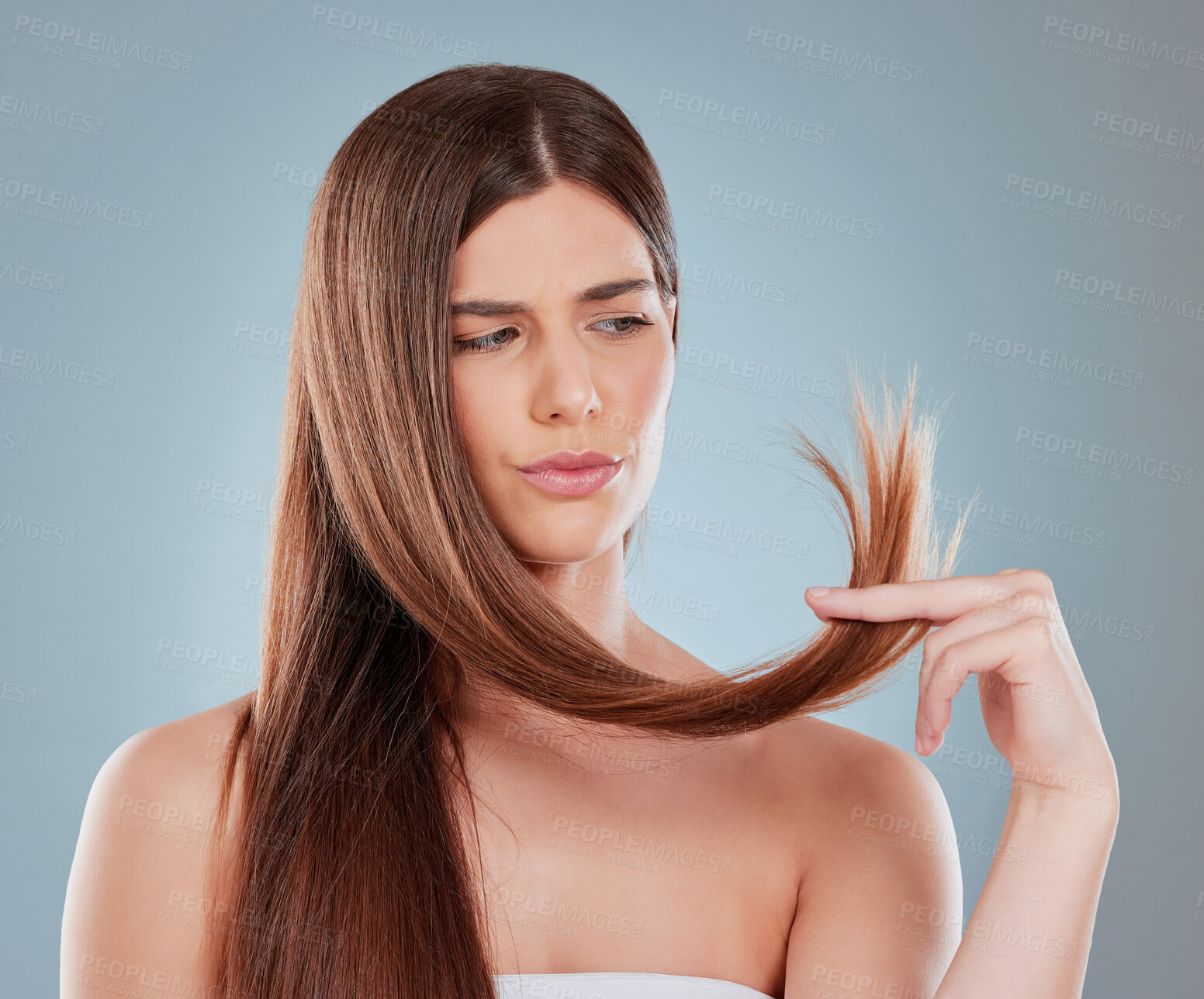 Buy stock photo Hair care, thinking and woman with concern in studio for salon treatment, growth and texture. Damage, problem and female person with worry for dry split ends, repair and remedy on gray background