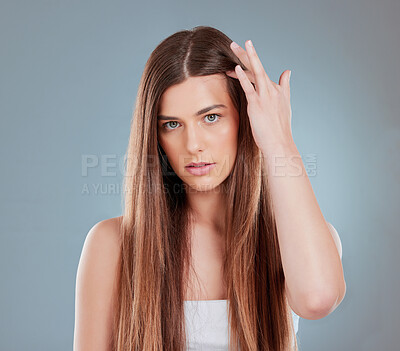 Buy stock photo Studio shot of a beautiful young woman showing off her long brown hair