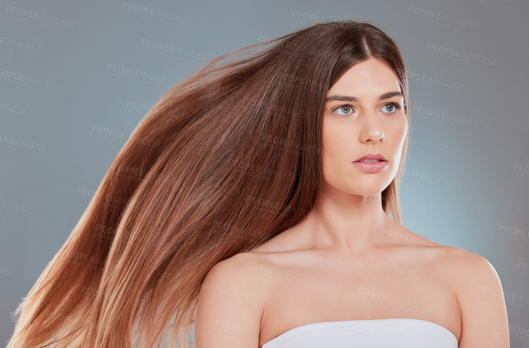 Buy stock photo Hair care, thinking and woman with wind in studio for shampoo treatment, shine and texture. Relax, serious and female person with confidence for salon growth, health and results on gray background