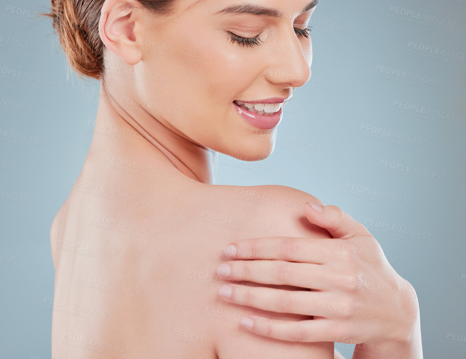 Buy stock photo Beauty, smile and woman with smooth skin in studio for hydration, moisturizing and clear body. Grooming, self care and female person touch shoulder for soft dermatology treatment by gray background.