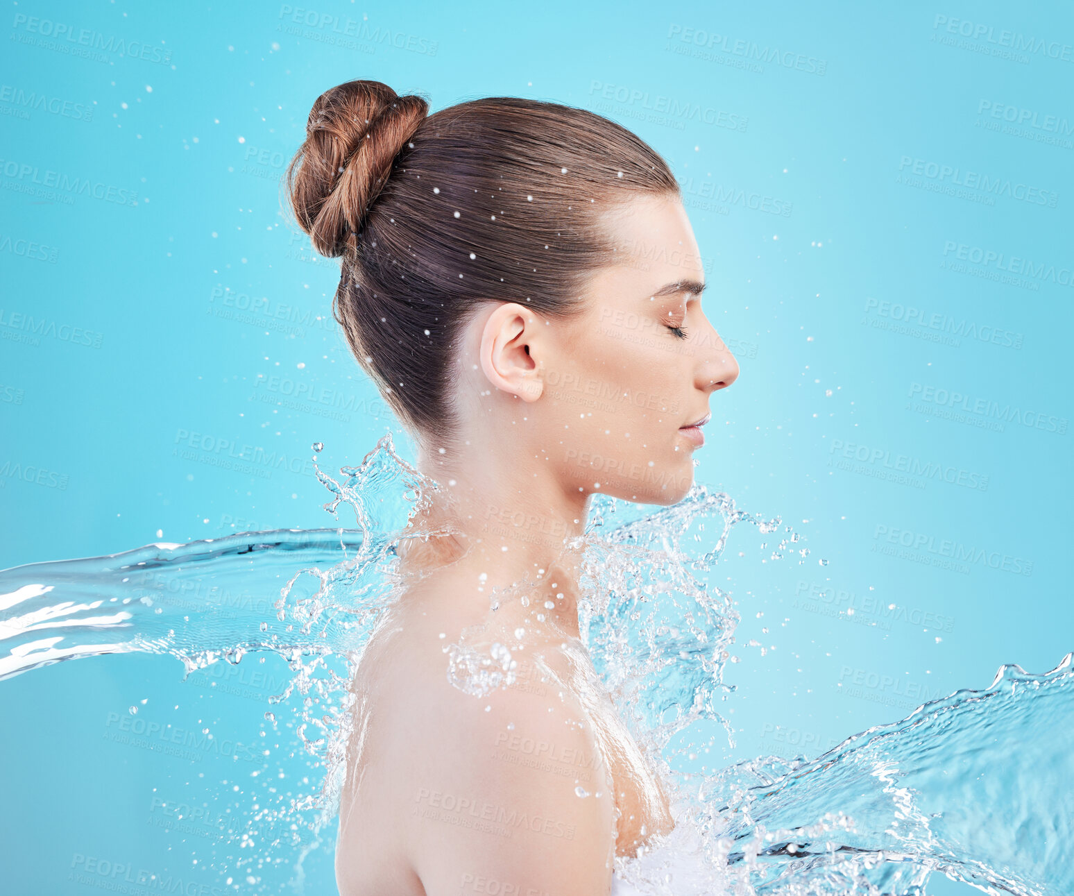 Buy stock photo Woman, relax and cleanse with water splash for hygiene, hydration or hydro skincare in studio on a blue background. Young female person, model or mineral liquid for shower, natural aqua or clean skin