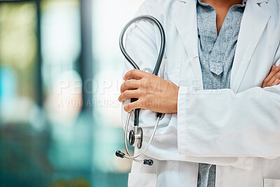 Buy stock photo Shot of an unrecognizable doctor holding a stethoscope at a hospital