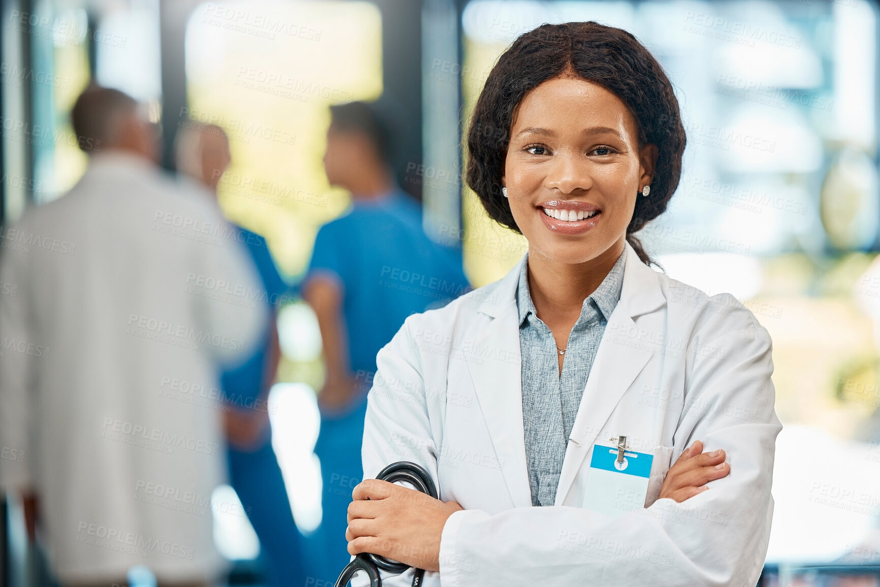 Buy stock photo Woman doctor, team and confident in portrait for medical, career success and healthcare in hospital. Female cardiologist, smile and arms crossed in lobby for pride, trust and health insurance