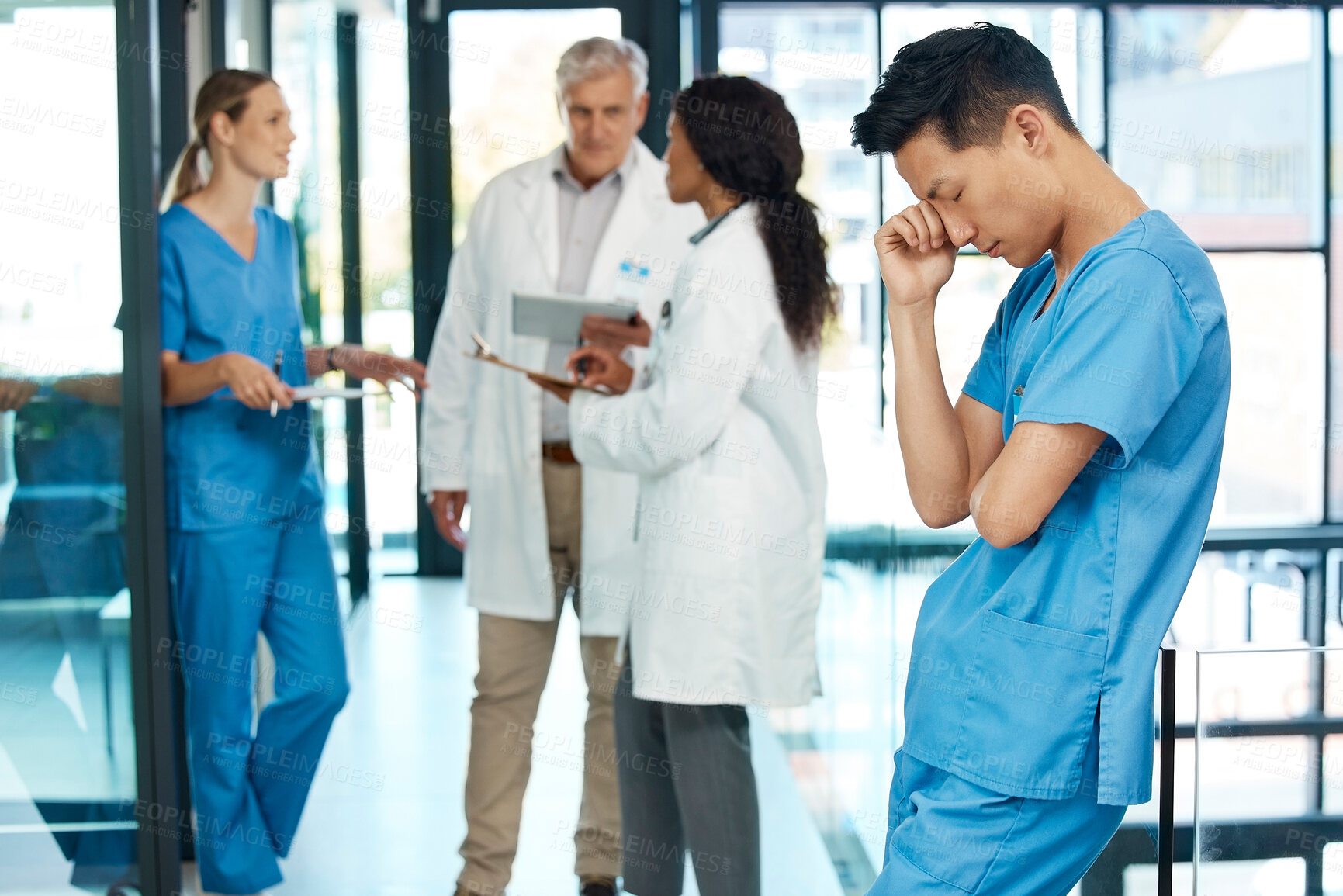 Buy stock photo Stress, tired nurse and man in clinic with insomnia, burnout or exhausted with coworkers. Fatigue, sleepy and overworked medical surgeon with boredom, deadline or sick worker in healthcare hospital