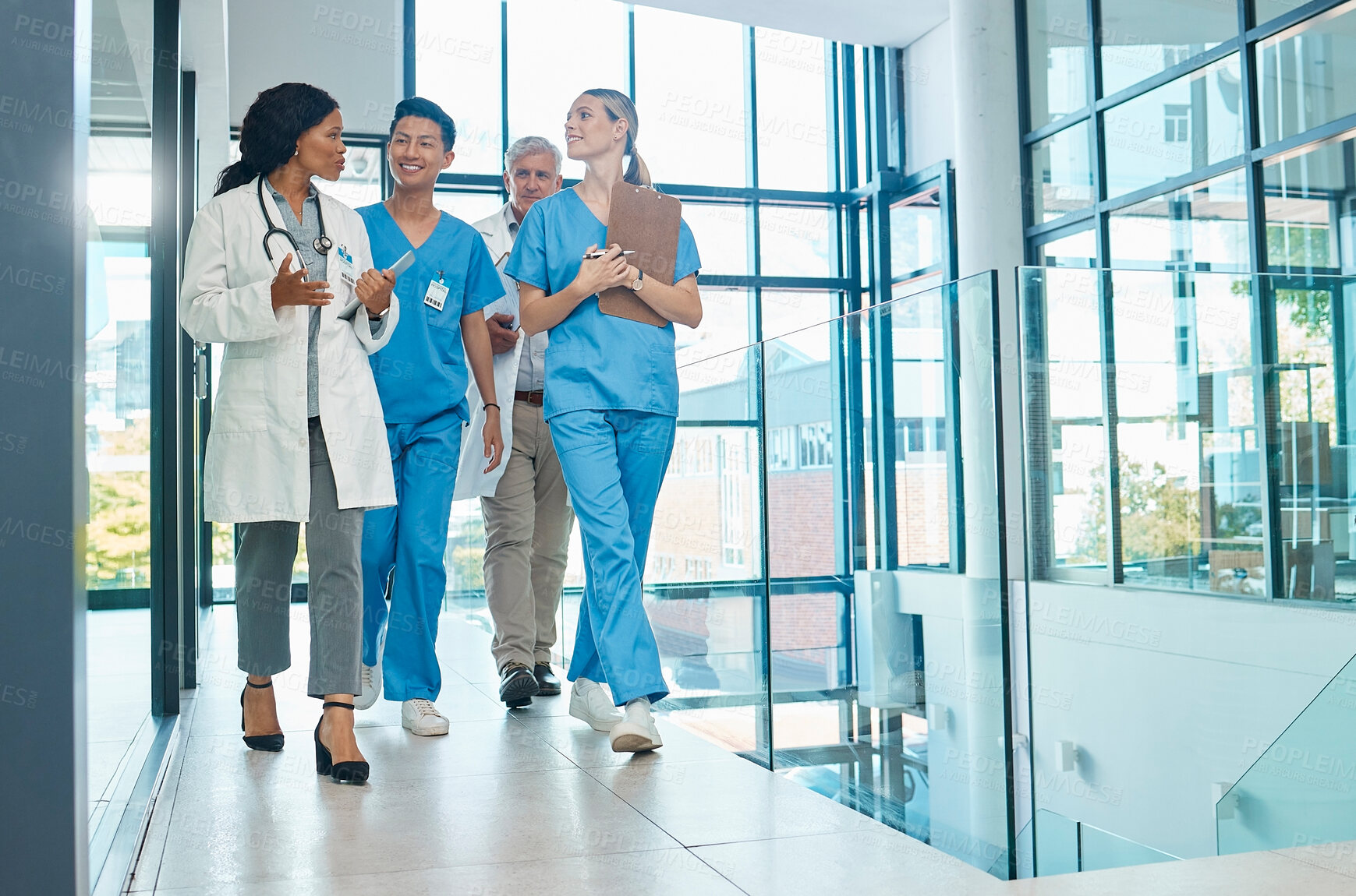 Buy stock photo Healthcare, doctors and nurses walking together for discussion, planning or schedule. Diversity, men or women medical group talking about support strategy, medicine and surgery teamwork in hospital