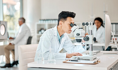 Buy stock photo Investigation, science and microscope with an asian man doctor working in a lab for research or innovation. Healthcare, medical and experiment with a male scientist in a laboratory for analysis