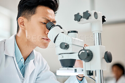 Buy stock photo Medical, science and microscope with an asian man doctor working in a lab for research or innovation. Healthcare, investigation and experiment with a male scientist in a laboratory for analysis