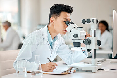 Buy stock photo Science, notebook and microscope with an asian man doctor working in a lab for research or innovation. Healthcare, medical and writing with a male scientist working in a laboratory for analysis