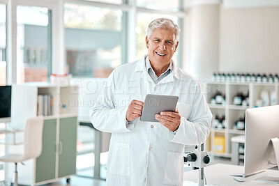 Buy stock photo Portrait of a senior scientist using a digital tablet in a lab