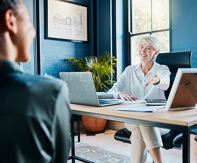 Buy stock photo Cropped shot of an attractive mature businesswoman meeting with an employee in her office