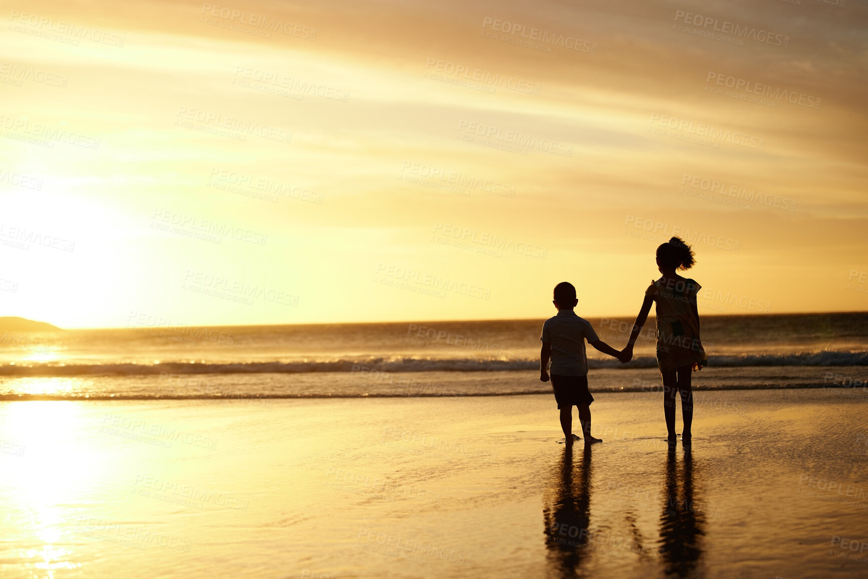 Buy stock photo Shot of an adorable brother and sister bonding at the beach