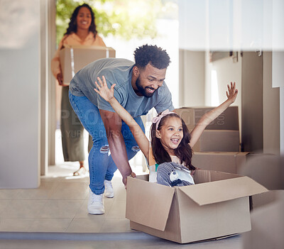 Buy stock photo Happy family, real estate and moving in new home with box for property, mortgage loan or celebration. Mother, father and little girl enjoying playing with boxes for fun relocation together in house