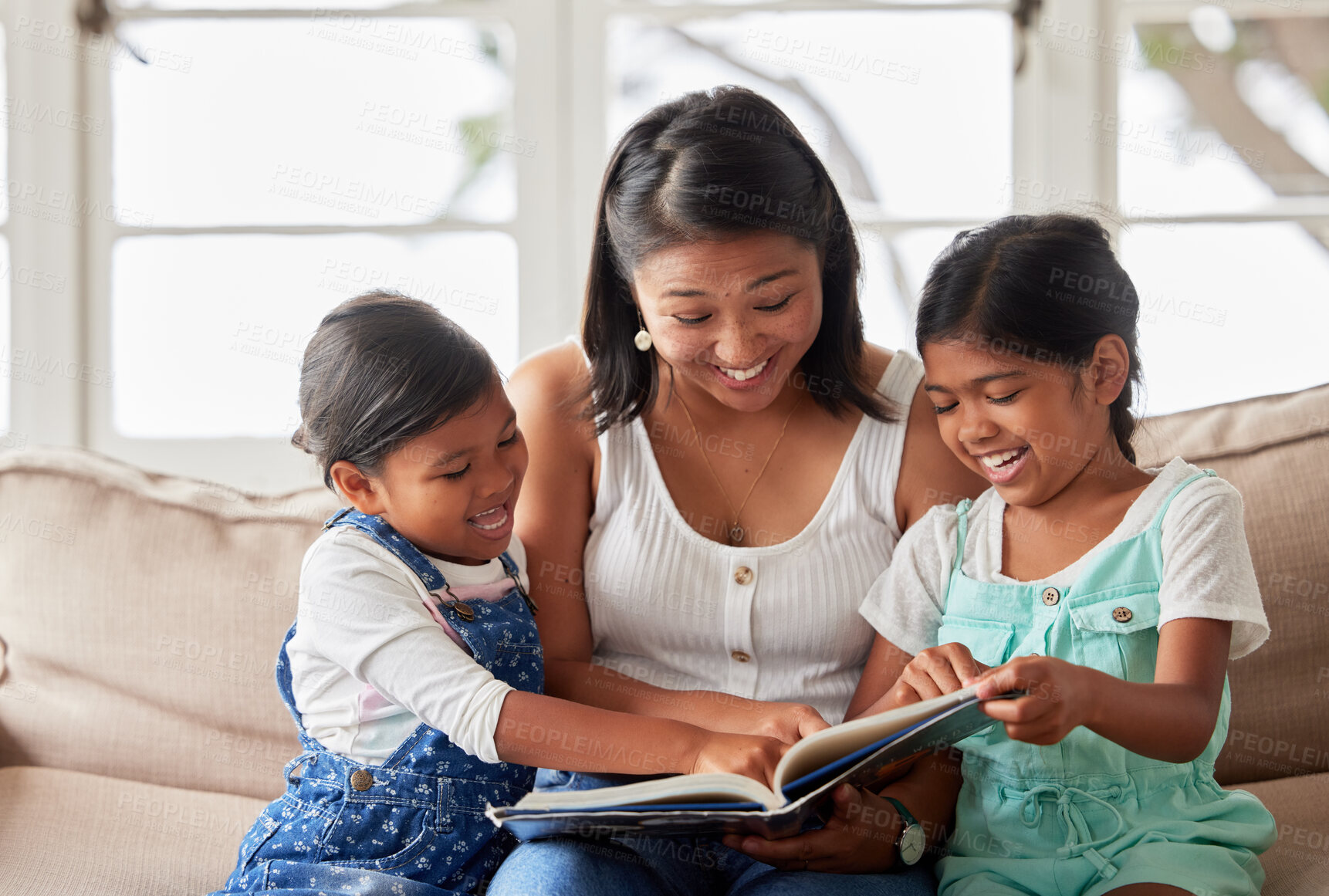 Buy stock photo Happy family, children and mother reading book on couch for learning, bonding or teaching in home together. Smile, education and mom with kids storytelling for fairytale, fantasy or child development