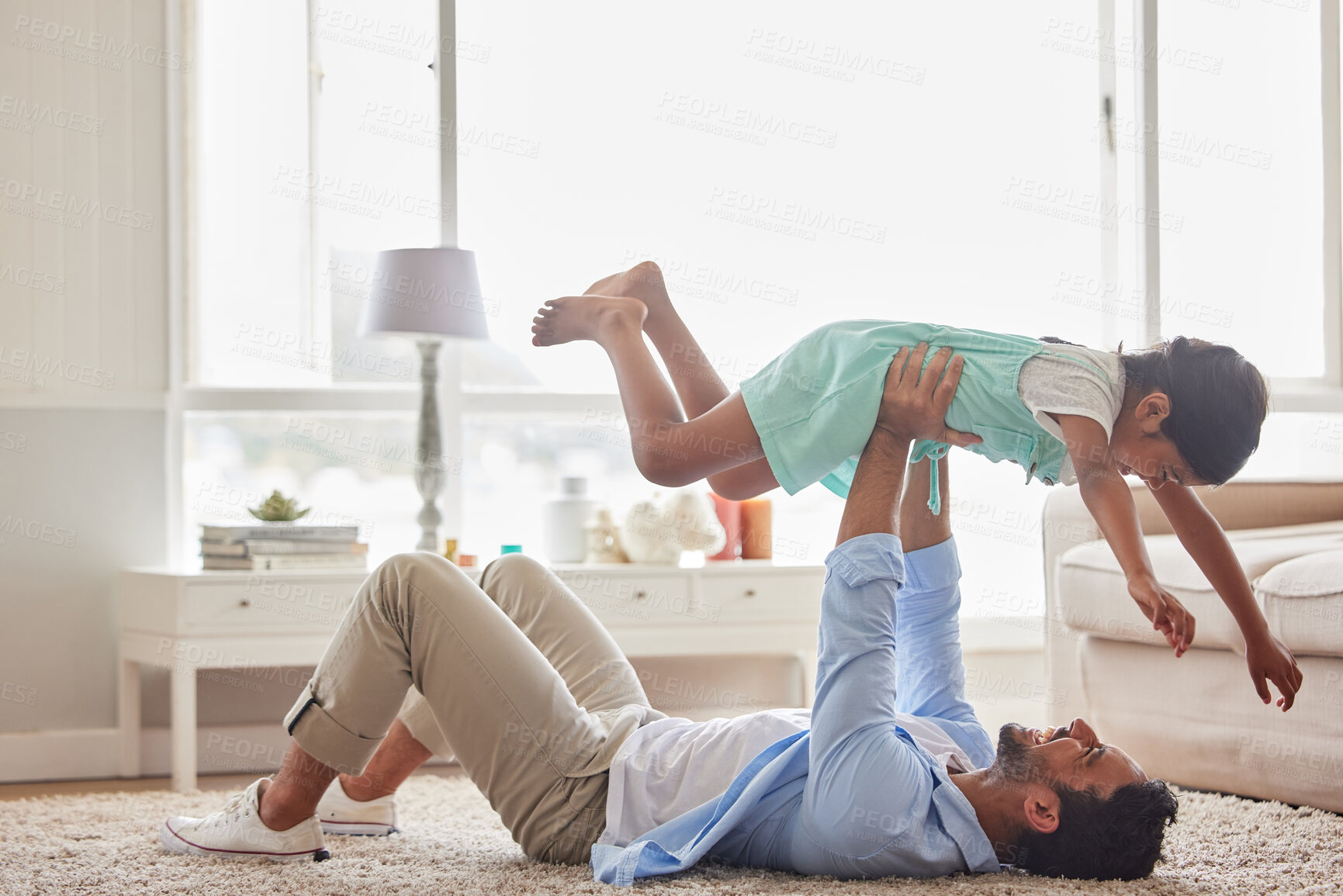 Buy stock photo Love, airplane and father with girl on a floor for games, fun and playing in their home together. Happy, flying and child with parent in living room for bonding, relax and enjoying weekend in lounge