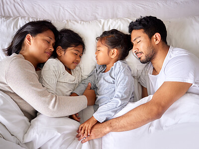 Buy stock photo Relax, love and family sleeping in a bed from above, peaceful and dreaming in their home. Sleep, peace and top view of children with parents in a bedroom, tired and resting together on the weekend