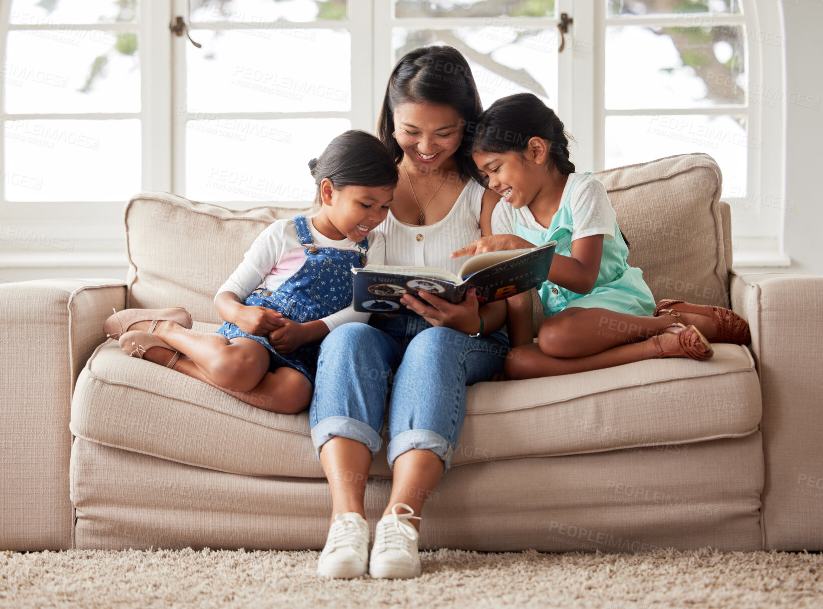 Buy stock photo Happy family, children and mom reading book on couch for learning, bonding or teaching in home together. Smile, education and mother with kids storytelling for fairytale, fantasy or child development