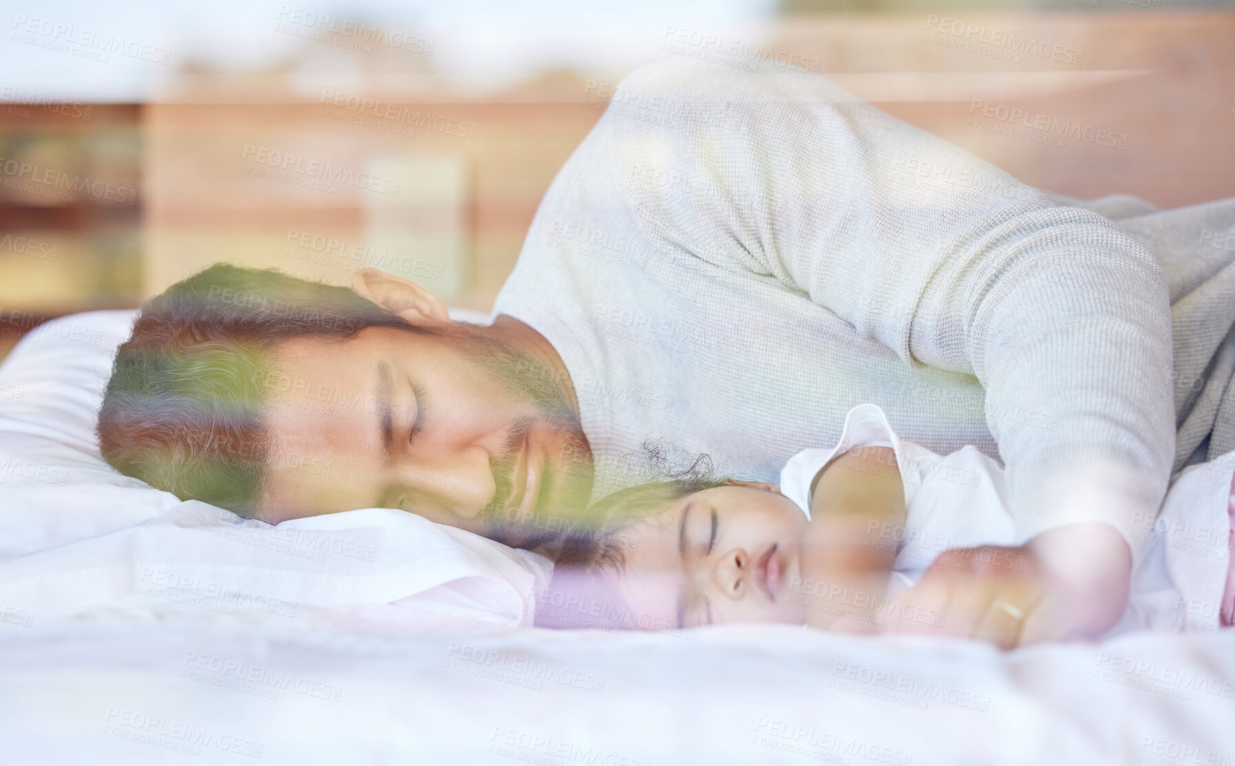 Buy stock photo Tired dad, baby and sleeping in bed, resting and hug for security in home or dream together. Father, exhausted and daughter to nap in bedroom for growth development, parent and bonding for love