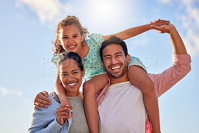 Buy stock photo Shot of a couple having fun outdoors with their adorable daughter