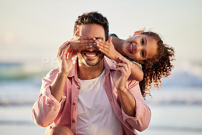Buy stock photo Shot of a man spending the day at the beach with his adorable daughter