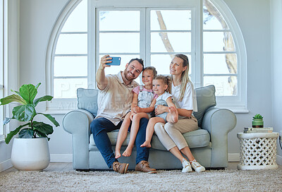 Buy stock photo Selfie, parents and kids in lounge, together and bonding on couch, photography and memory in house. Online, profile picture and family with love, mom and dad with children in living room and sofa