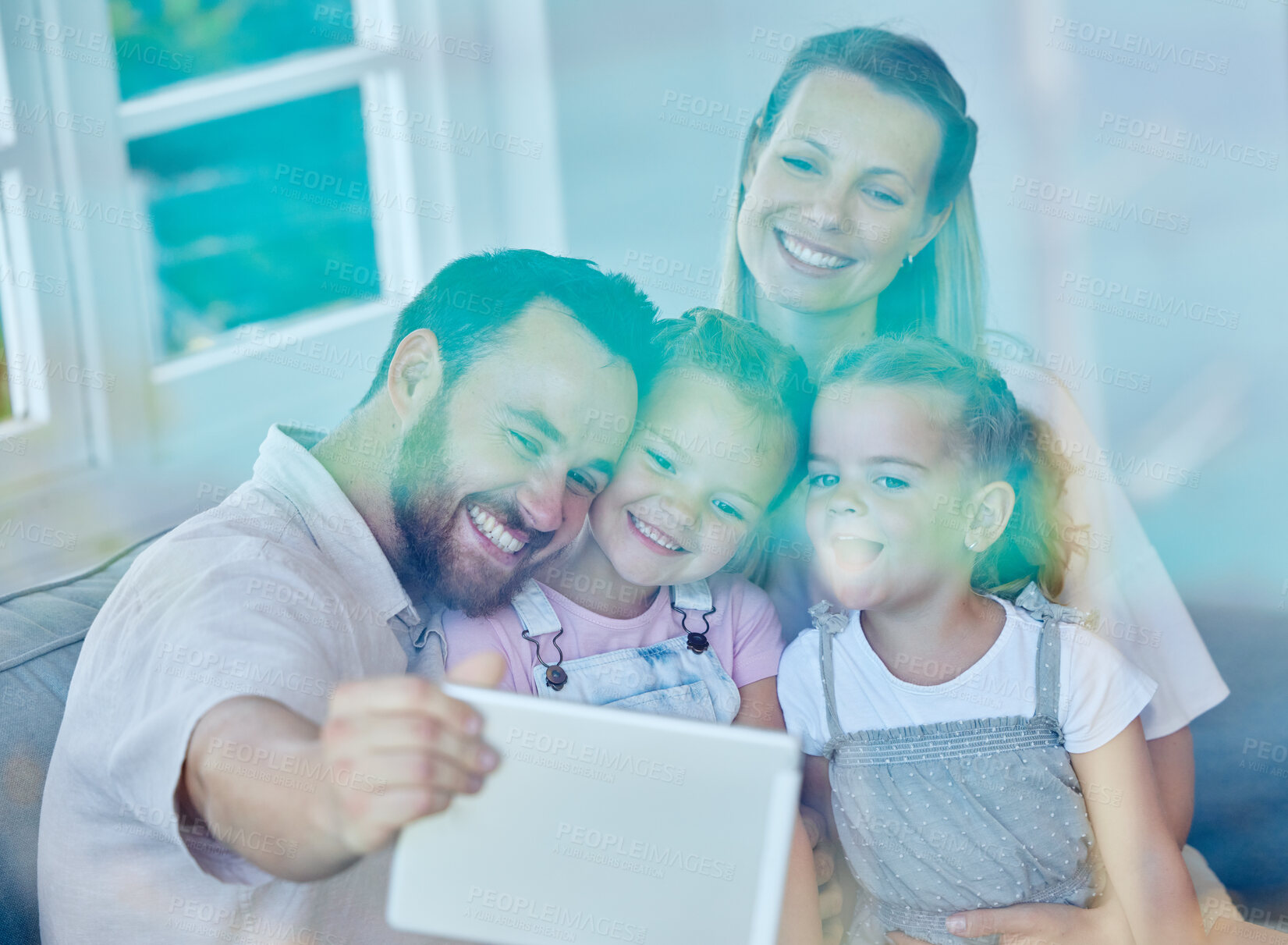 Buy stock photo Smile, family and selfie on sofa at house for love, bonding and care for photography of social media post. Happy, woman and man with girls in living room, tablet and together for childhood memory
