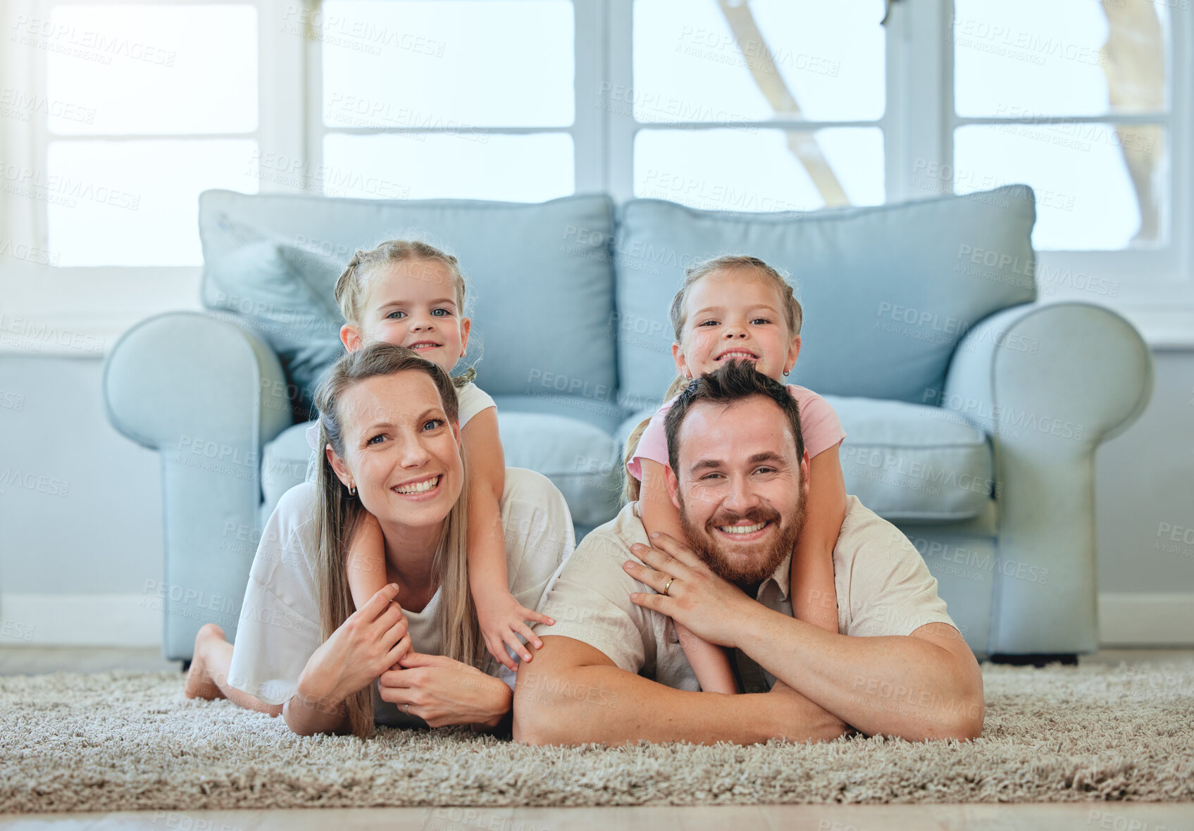Buy stock photo Family, portrait and piggyback on floor with children in house living room for bonding, love and happy. Parents, girl and hug on ground with smile, face and carpet for relax, calm and peace together