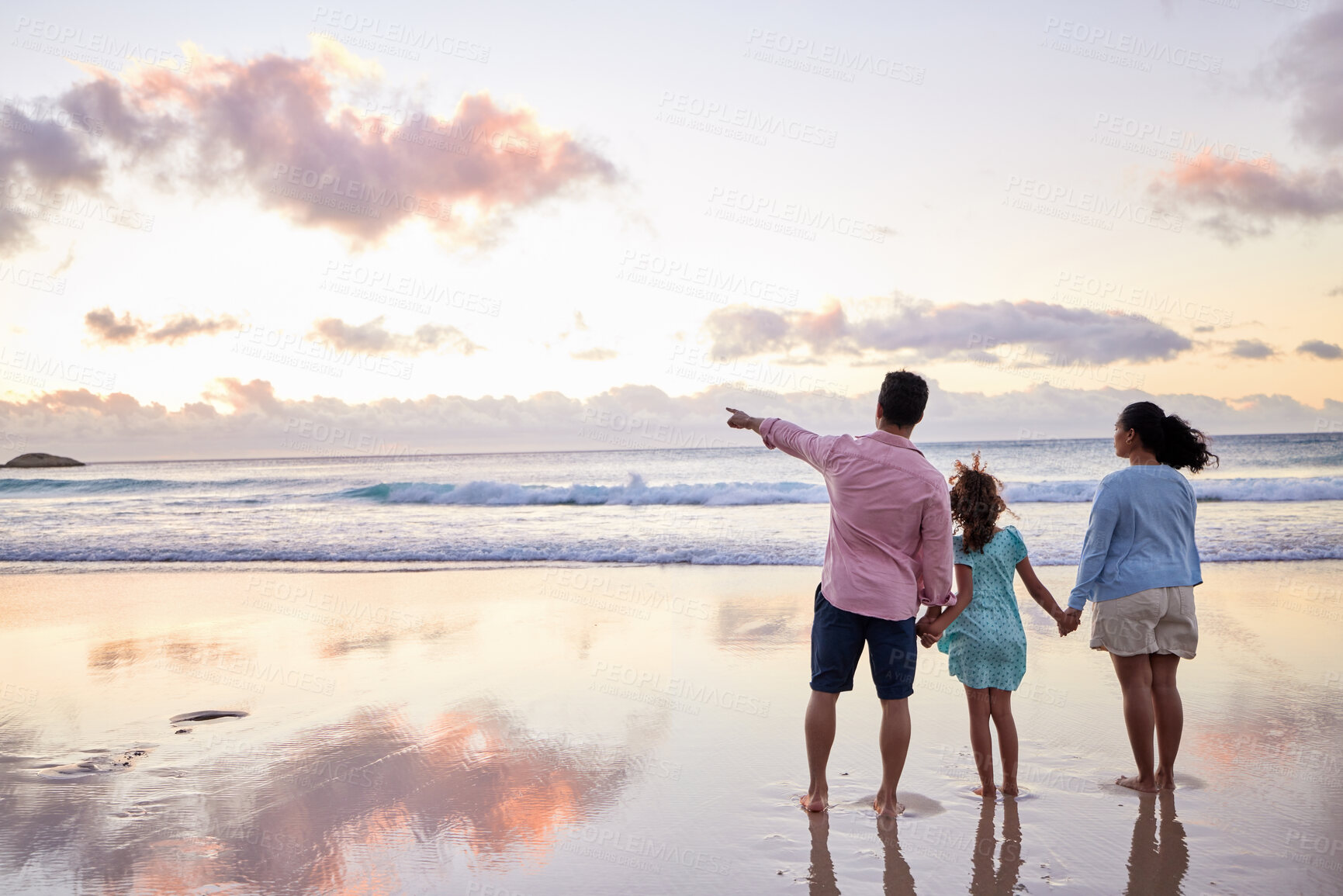 Buy stock photo Beach, family and man with pointing at sunset for summer travel, adventure and view on holiday. Mom, dad and daughter with direction by ocean for vacation, tourism and sightseeing in Turks and Caicos