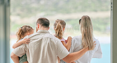 Buy stock photo Shot of an unrecognizable family admiring the view from their balcony at home