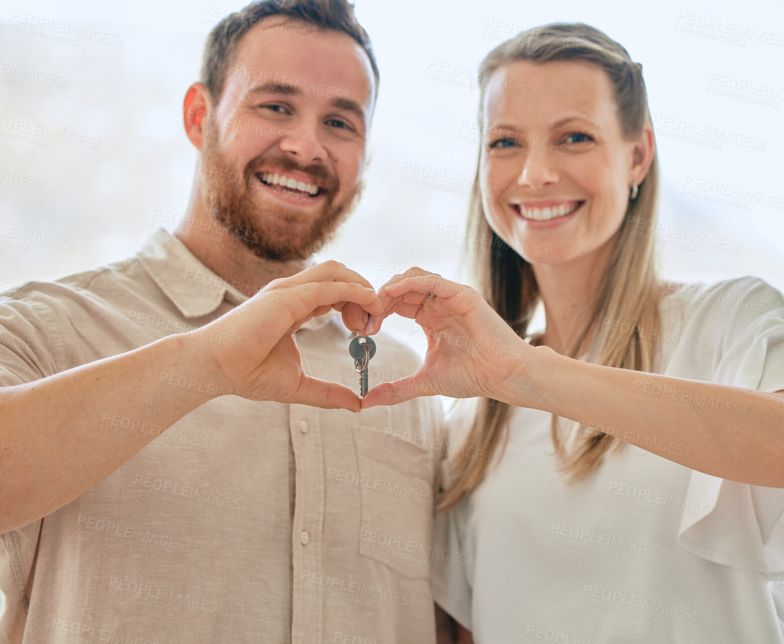 Buy stock photo Portrait, hands heart and couple with key for new house for moving in or relocating for real estate. Woman, man and together as excited for apartment, home or property as married people in Canada