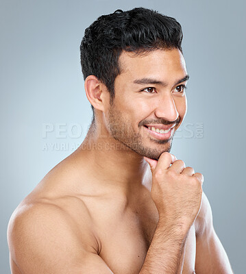 Buy stock photo Happy man, thinking and hand in studio for dermatology for grooming and pride for glow. Male model, memory and inspiration for luxury treatment, shine and routine for clean face by gray background