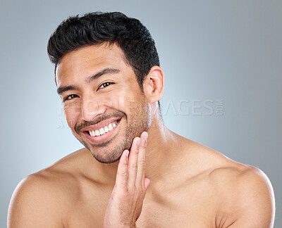 Buy stock photo Beauty, portrait and smile of natural man in studio on gray background for cosmetic wellness. Dermatology, grooming and skincare with face of happy person in bathroom for hydration or hygiene