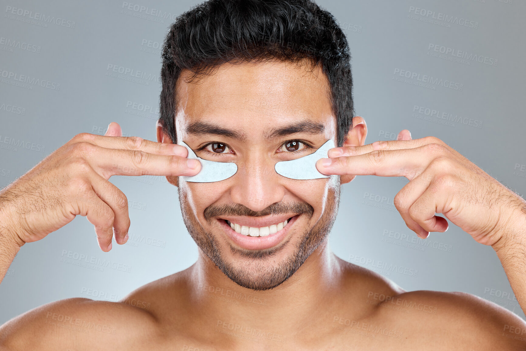 Buy stock photo Portrait, man and eye patch for beauty, smile and skincare and hands on white background. Studio, dermatology and facial treatment with collagen product, asian person and grooming for anti aging