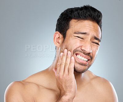 Buy stock photo Pain, man and studio with hand for toothache, mouth and sore on white background. Dental care, cavity and medical help for gum disease and injury for male person, decay and cheek for healthy teeth 