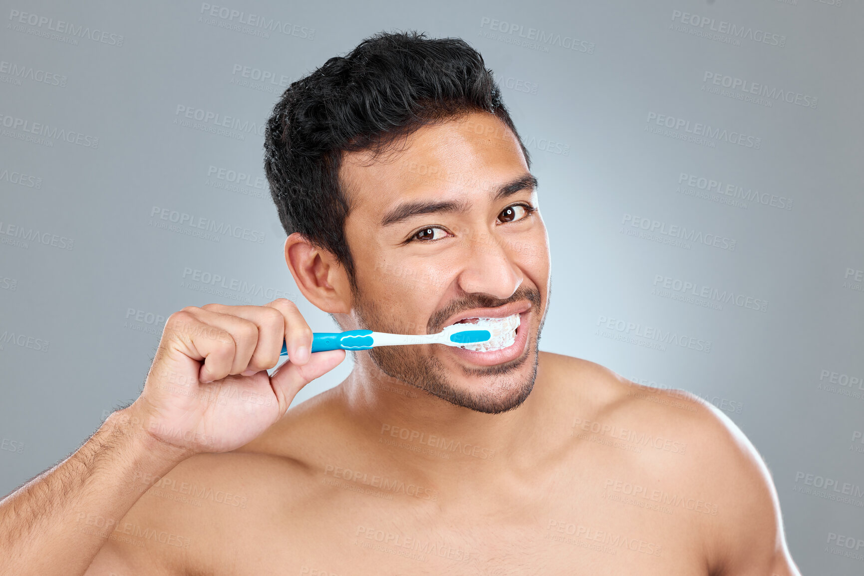 Buy stock photo Toothbrush, toothpaste and portrait of shirtless man in studio on gray background for cosmetic wellness. Brushing teeth, cleaning or hygiene with confident person in bathroom for dental and oral care