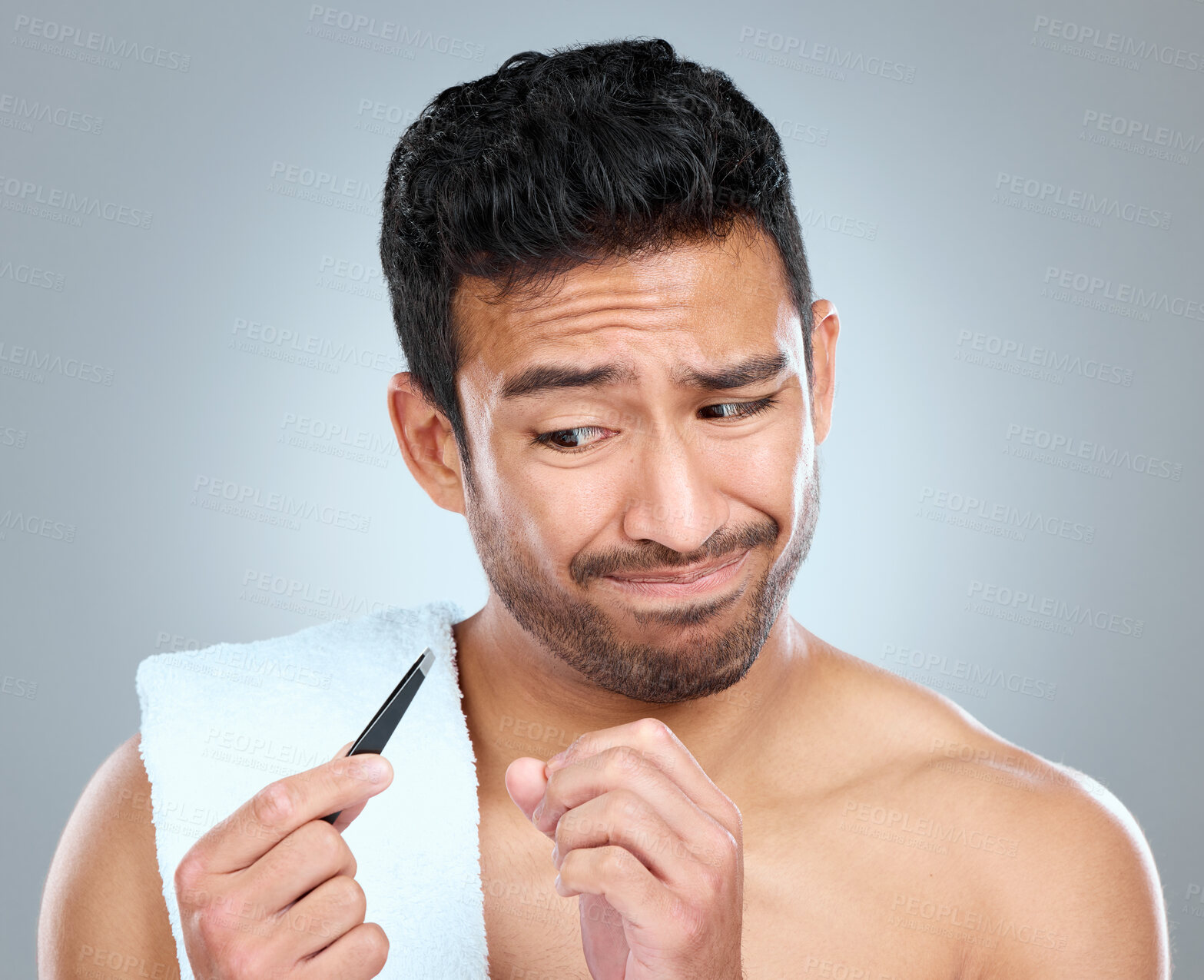 Buy stock photo Tweezer, hair removal and sacred man in studio, grooming and cosmetic on white background. Towel, confused emotion and male person for plucking, routine and eyebrow for selfcare cleaning for skincare