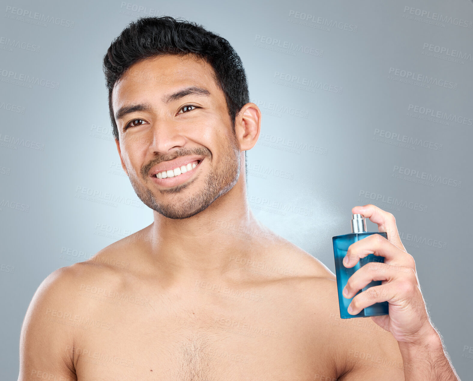 Buy stock photo Man, apply cologne and bottle in studio, body care and perfume spray on gray background. Male person, deodorant essence and container for aroma or fresh scent, clean smell and shirtless for fragrance