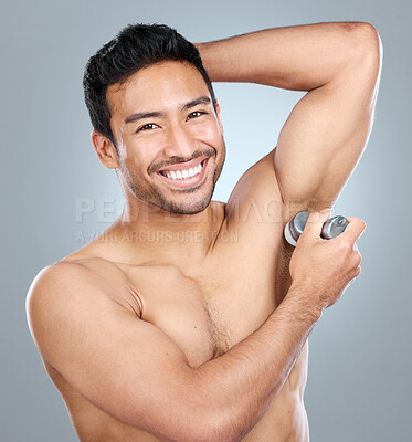 Buy stock photo Beauty, grooming and deodorant of masculine man in studio on gray background for cosmetic wellness. Dermatology, natural and roll on with face of confident person in bathroom for hydration or hygiene