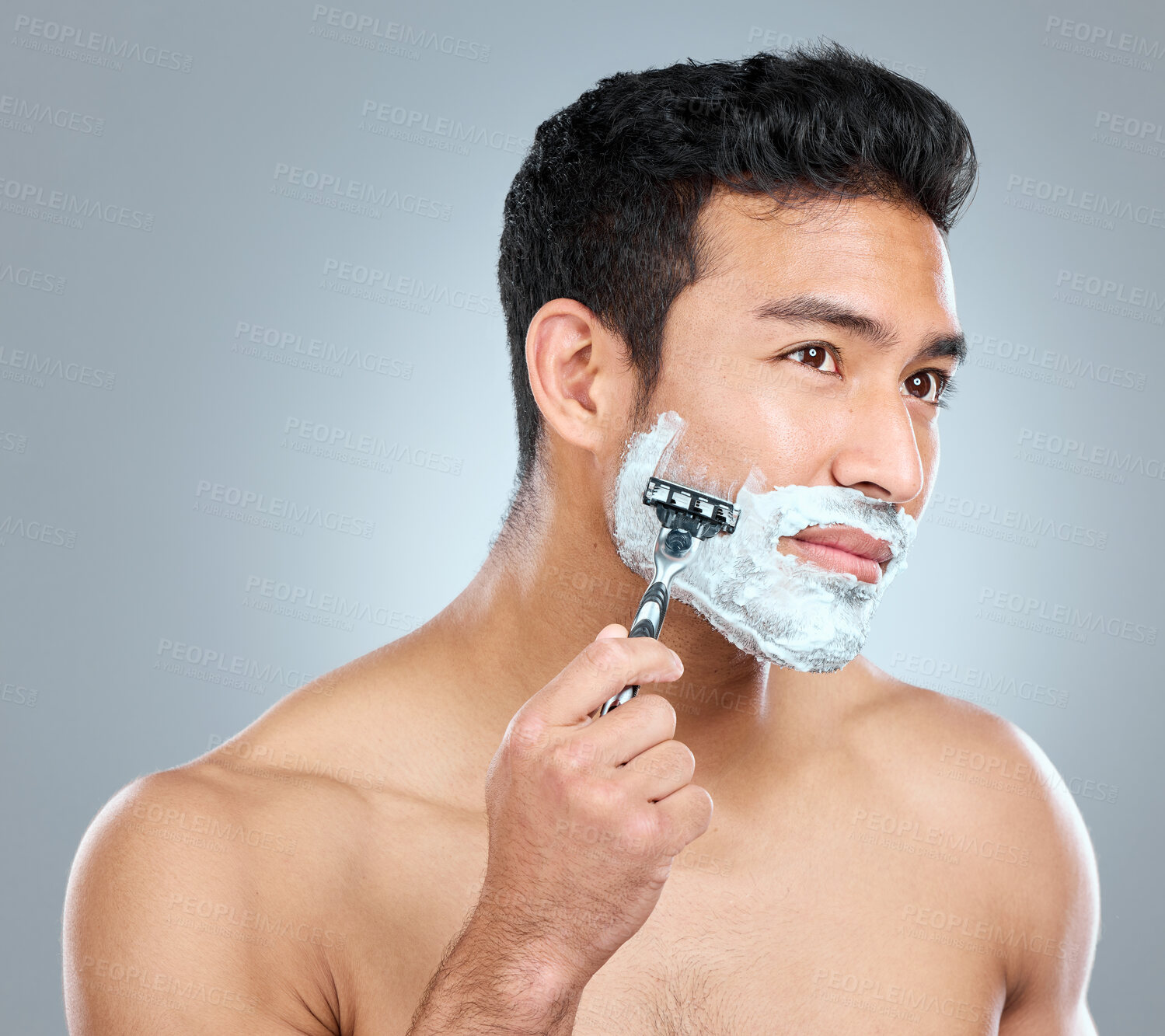 Buy stock photo Shaving cream, face and model with razor in studio isolated on a gray background. Epilation, cleaning and thinking shirtless man with facial product, foam or gel to shave for wellness or hair removal