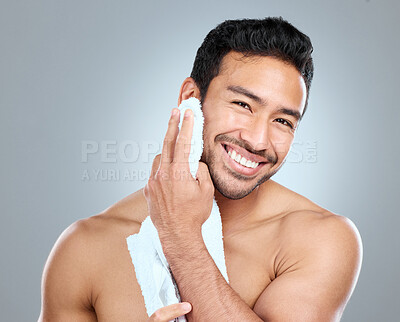 Buy stock photo Beauty, cleaning and grooming with portrait of man in studio on gray background for cosmetic wellness. Dermatology, skincare and towel with face of happy person in bathroom for hydration or hygiene