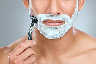 Buy stock photo Shaving cream, mouth and model with razor in studio isolated on a gray background. Epilation, cleaning and shirtless man with facial product, foam or gel to shave for wellness or hair removal