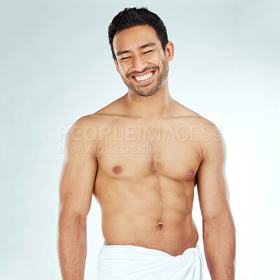 Buy stock photo Body, cleaning and happy asian man in a towel in studio for beauty, hygiene and care on grey background. Face, smile and muscular Japanese male model with glowing skin grooming results after shower