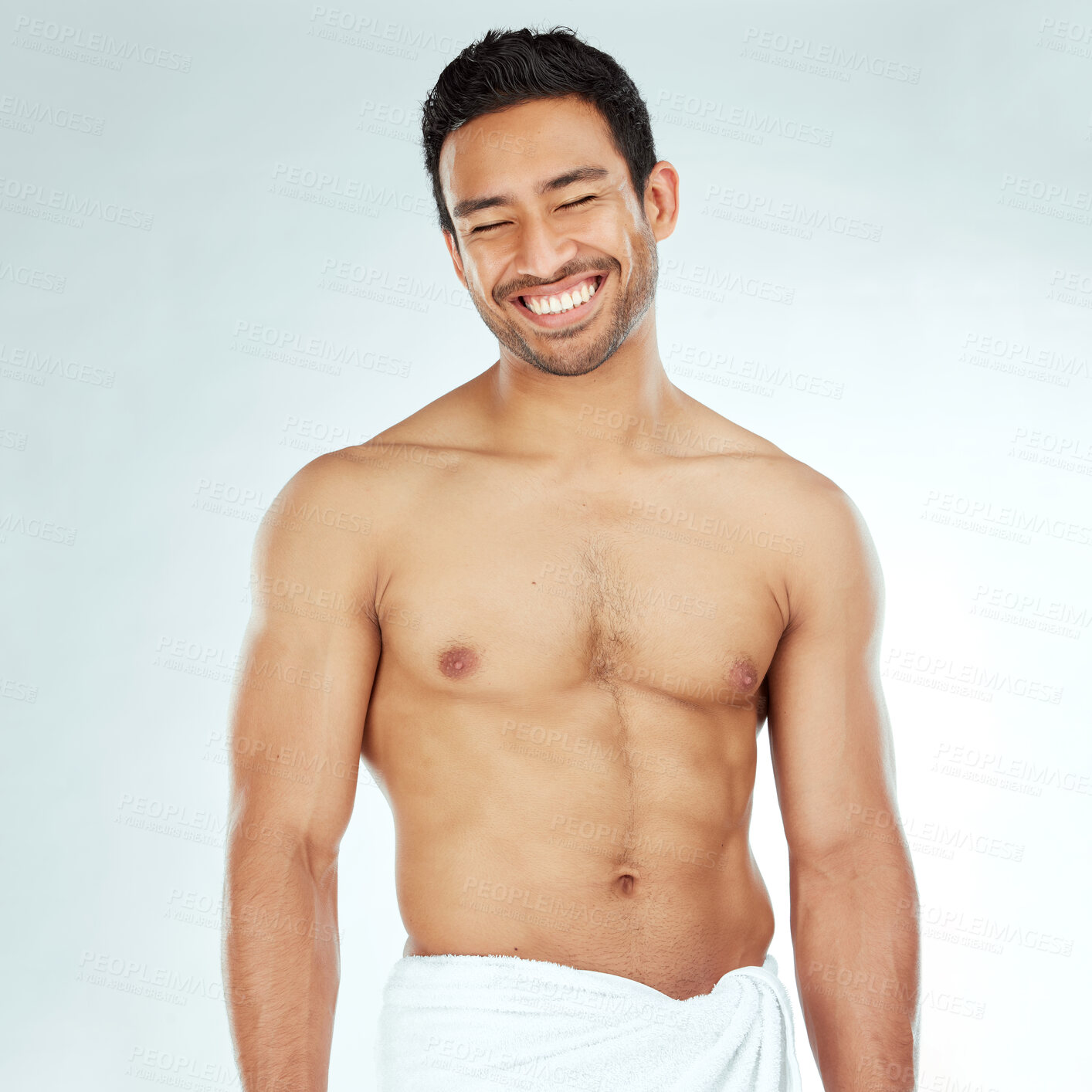 Buy stock photo Body, cleaning and happy asian man in a towel in studio for beauty, hygiene and care on grey background. Face, smile and muscular Japanese male model with glowing skin grooming results after shower