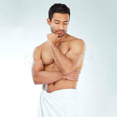Buy stock photo Shower, towel and fitness man thinking in studio for wellness, hygiene or body care routine on white background. Cleaning, grooming or muscular Japanese male model with pamper, cosmetics or treatment