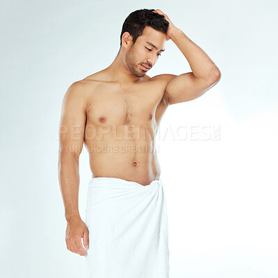 Buy stock photo Towel, shower and fitness man thinking in studio for wellness, hygiene or body care routine on white background. Cleaning, grooming or muscular Japanese male model with pamper, cosmetics or treatment