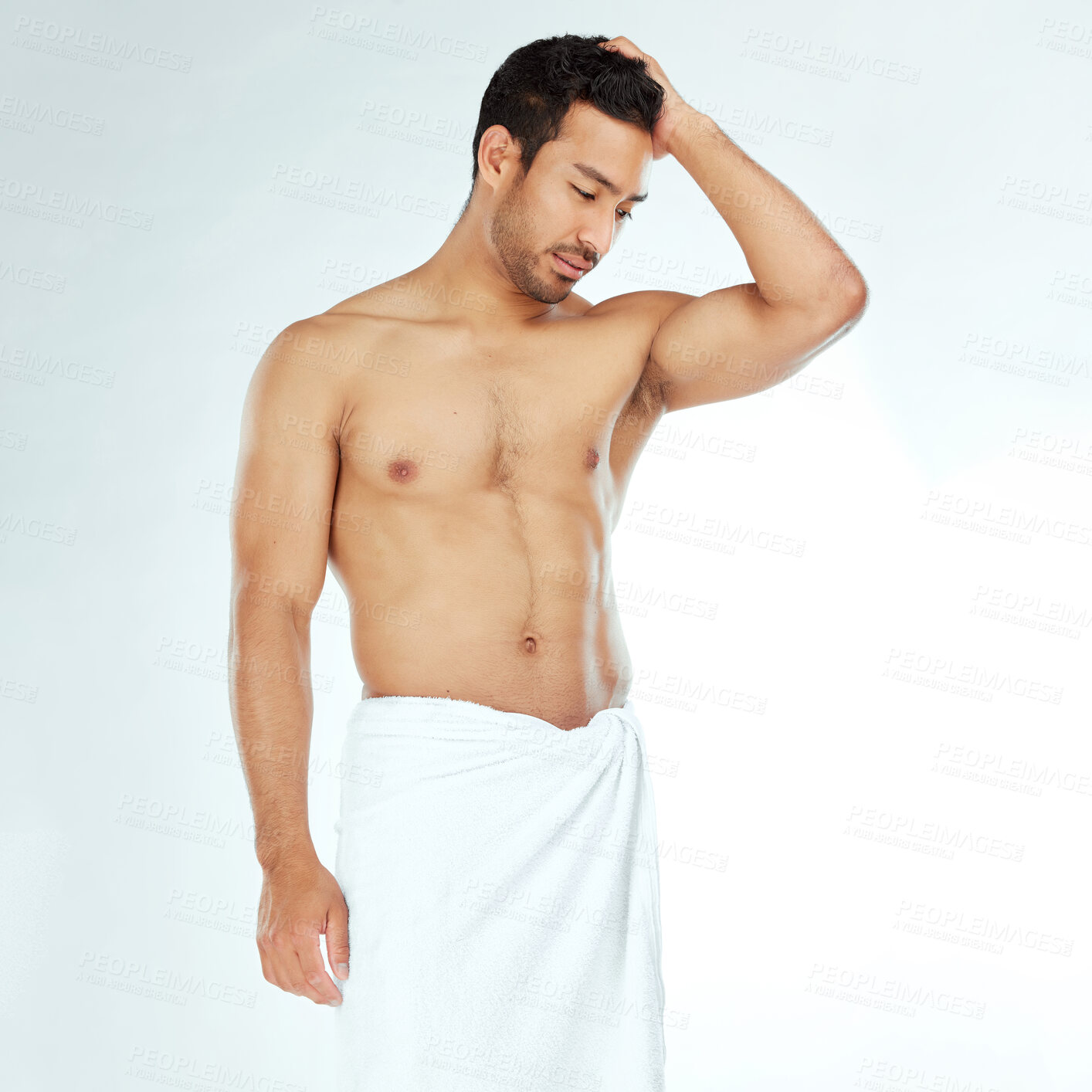 Buy stock photo Towel, shower and fitness man thinking in studio for wellness, hygiene or body care routine on white background. Cleaning, grooming or muscular Japanese male model with pamper, cosmetics or treatment