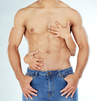 Buy stock photo Shot of a man having his body caressed against a studio background