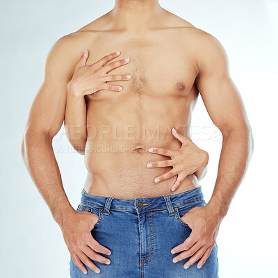 Buy stock photo Shot of a man having his body caressed against a studio background