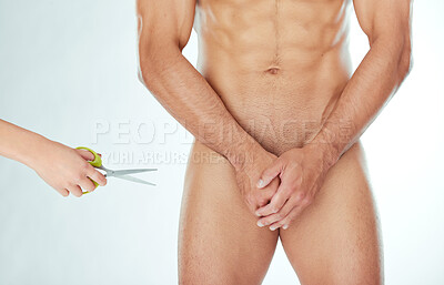 Buy stock photo Shot of a man removing genital hair against a studio background