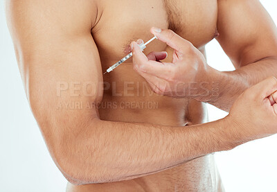 Buy stock photo Shot of a man injecting his bicep with steroids against a studio background