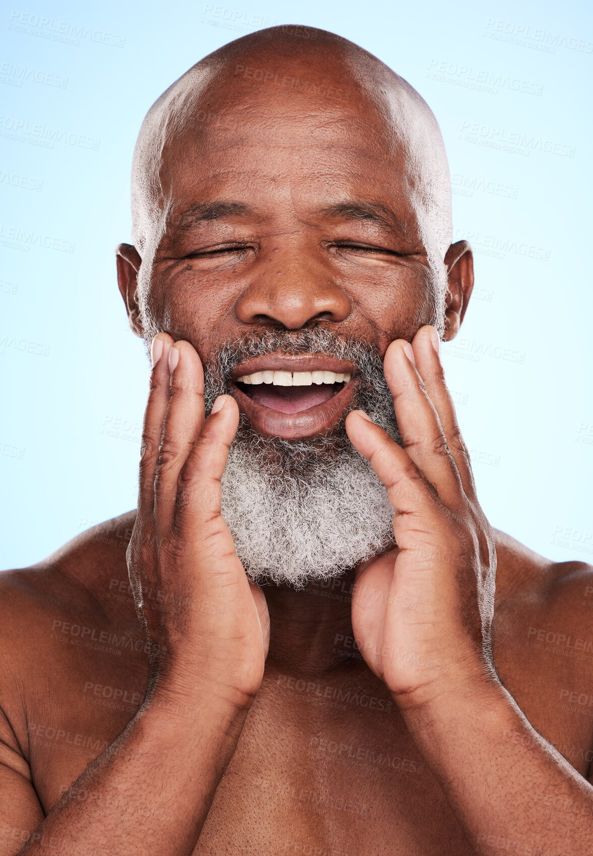 Buy stock photo Skincare, hands and senior African man in studio for dermatology, wellness and treatment. Happy, black male person and healthy glow, shine and aesthetic by blue background for retirement or morning